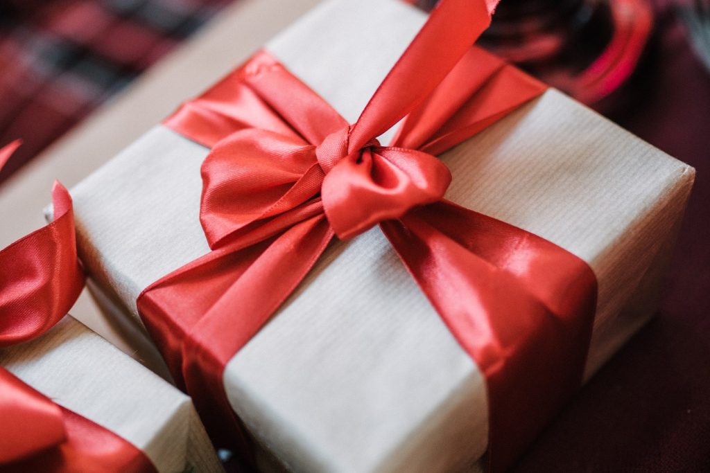 Authentic luxury corporate holiday gift box with bespoke satin red ribbon